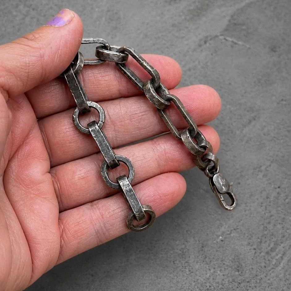 Rustic industrial oxidized pendant bracelet by JJewelryArt featuring a rugged, handcrafted metal design on a leather strap.
