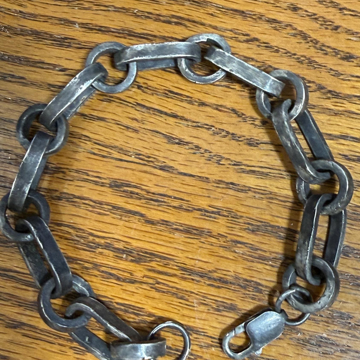 Rustic oxidized industrial pendant bracelet by JJewelryArt featuring a rugged metal design on a sturdy chain.