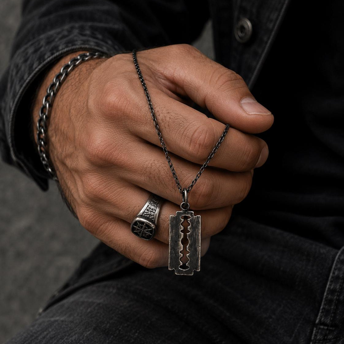 Silver razor blade pendant necklace by JJewelryArt featuring a sleek, modern design on a silver chain.