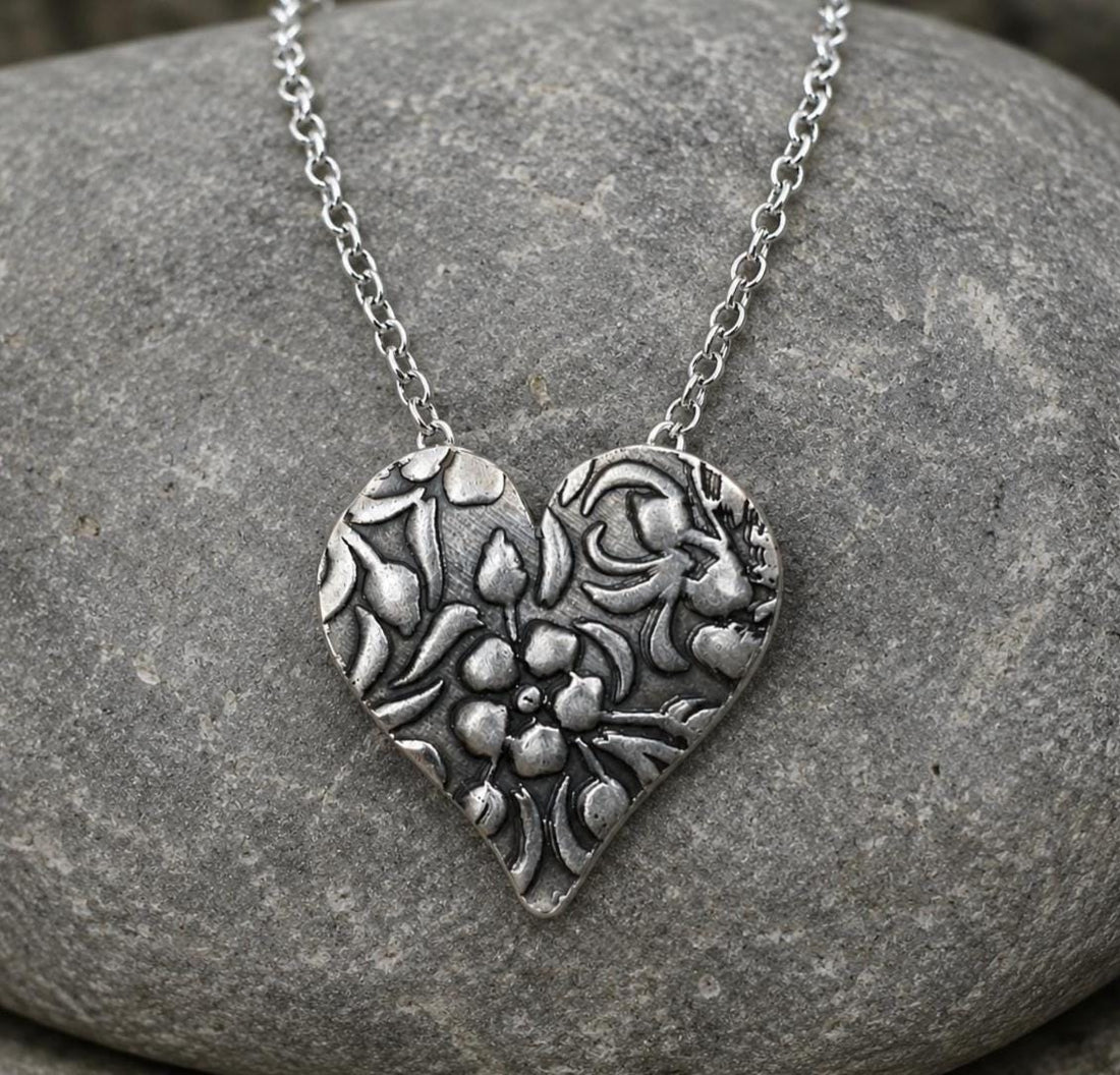 Silver floral heart necklace by JJewelryArt featuring botanical-inspired design on a delicate chain.