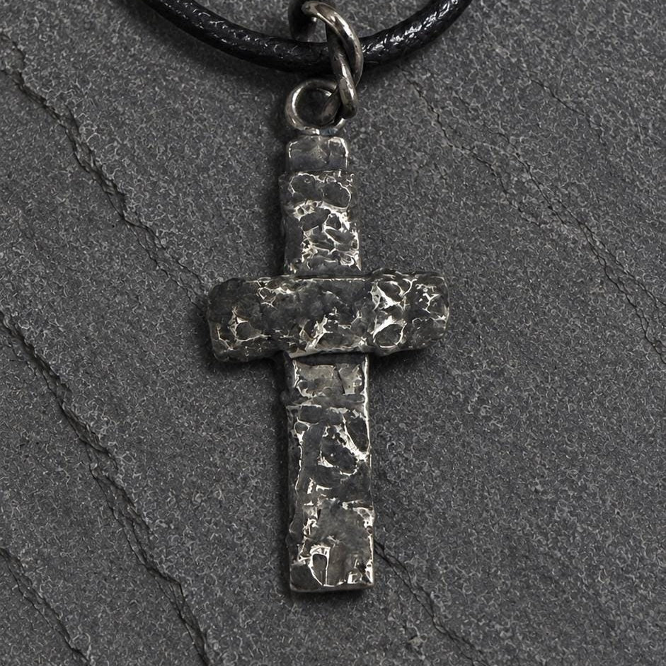 Silver rustic cross pendant by JJewelryArt featuring a detailed, handcrafted design on a sleek pendant necklace.