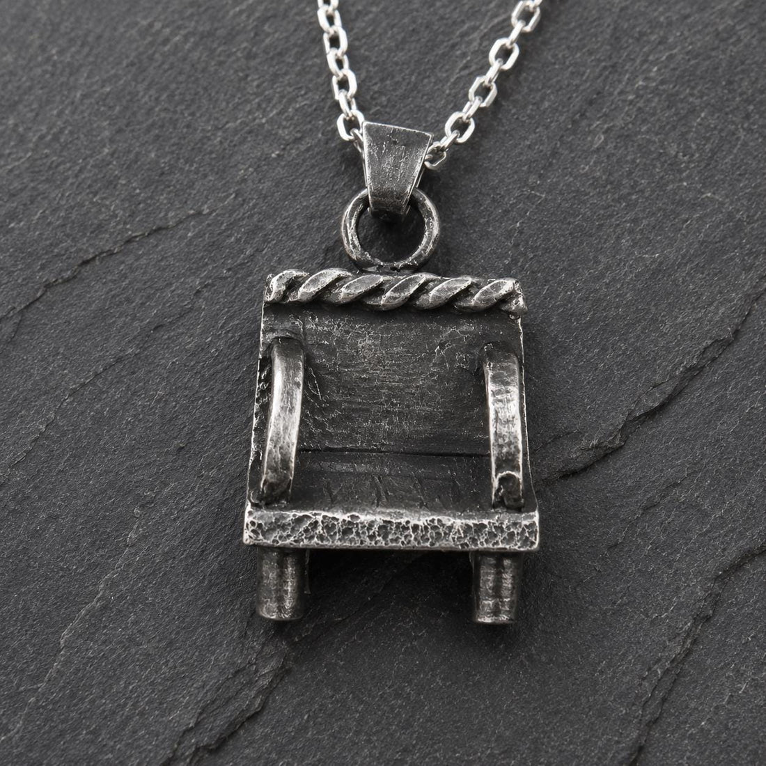 Silver artisan chair pendant necklace by JJewelryArt featuring a detailed, handcrafted chair charm on a sleek silver chain.