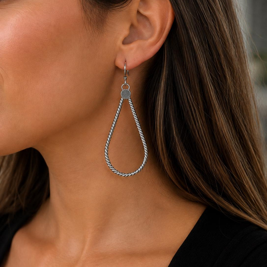 Silver statement hoops earrings by JJewelryArt featuring bold, large hoop design with a sleek, polished finish.