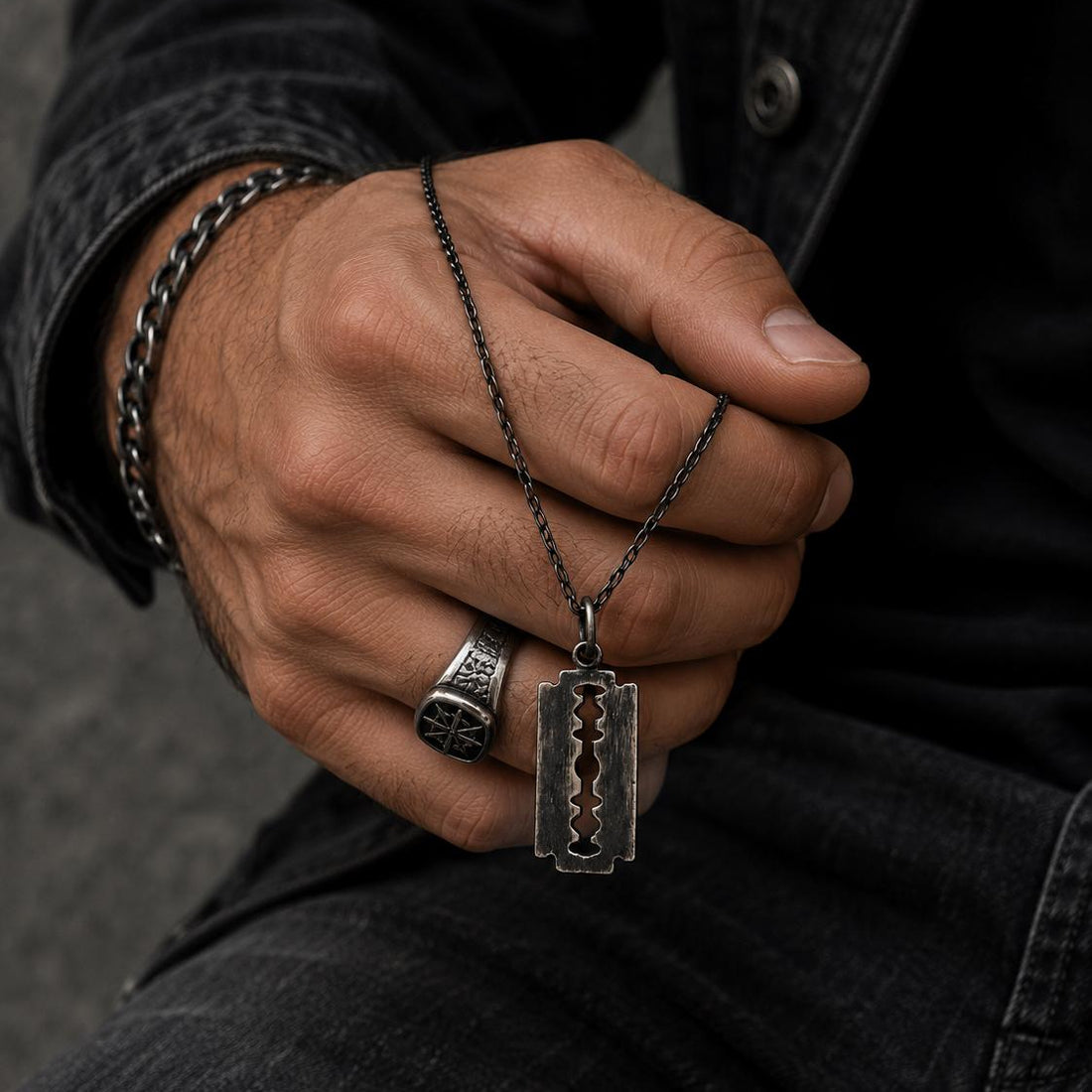 Silver razor blade pendant necklace by JJewelryArt featuring a sleek, modern design on a silver chain.