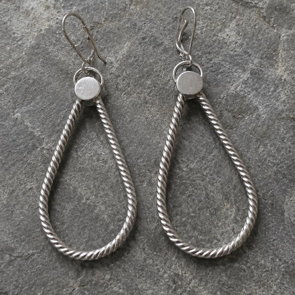 Silver statement hoops earrings by JJewelryArt featuring bold, shiny hoop design perfect for stylish accessorizing.