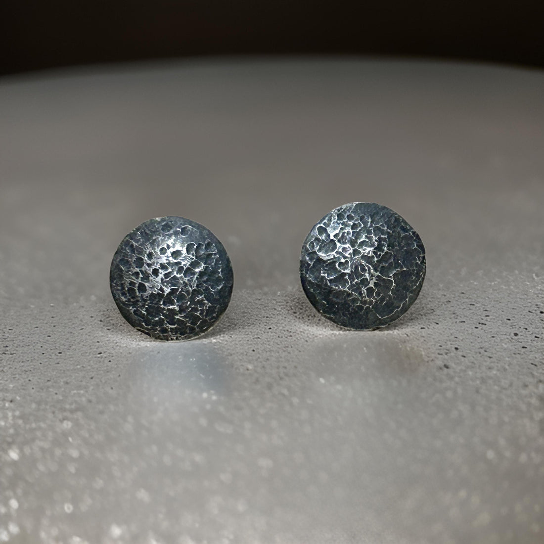 Rustic silver circle textured earrings by JJewelryArt, small size with a handcrafted, artistic design.