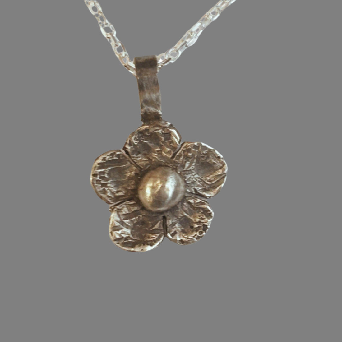 Flower Necklace handcrafted in sterling silver. with oxidized touch